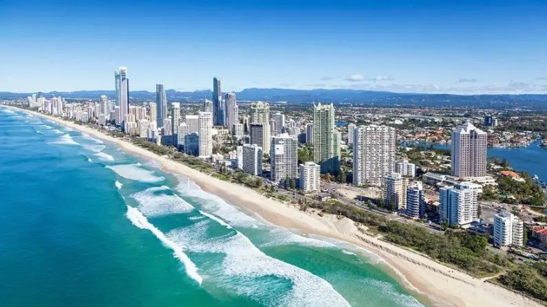Moving to Queensland with the view of the ocean, beach and high rise buildings